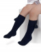 Calcetines altos lisos con borlas